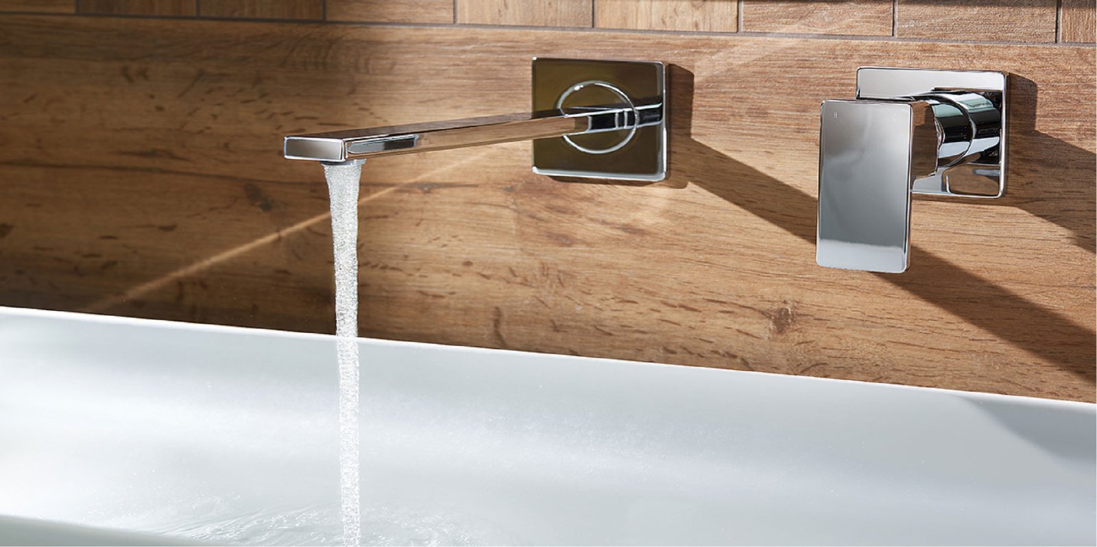 Modern wall-mounted bath mixer tap