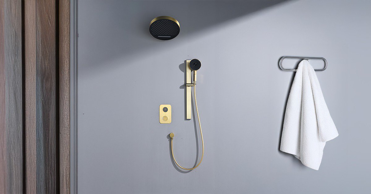 Gold wall-mounted shower panel.
