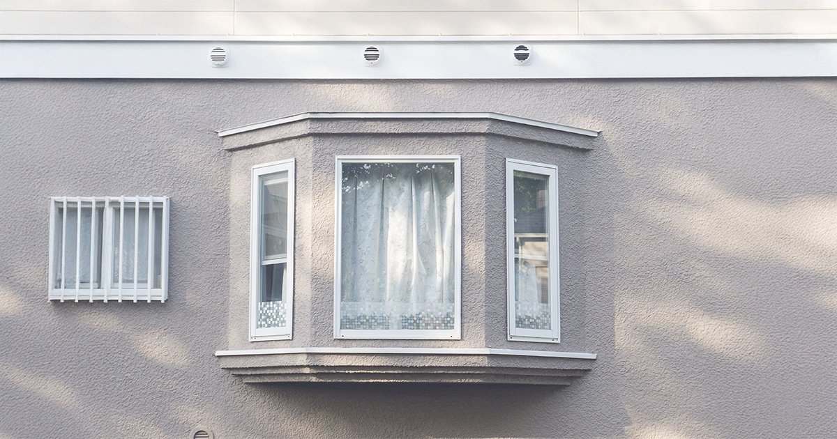 white bay window with blinds