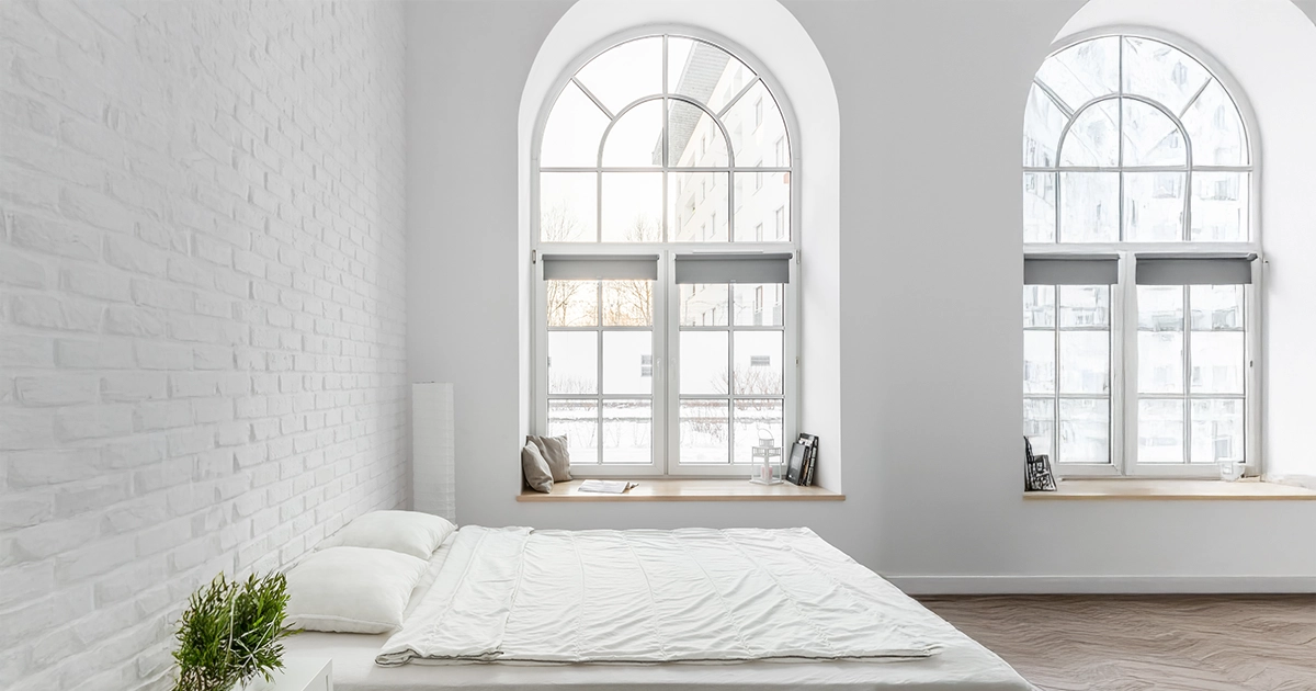 Bedroom with uPVC arch windows.
