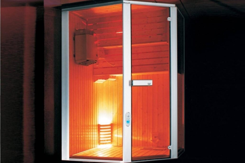 Modern indoor sauna cabin with warm wooden interiors, showcasing sauna benefits such as relaxation, detox, and overall wellness.
