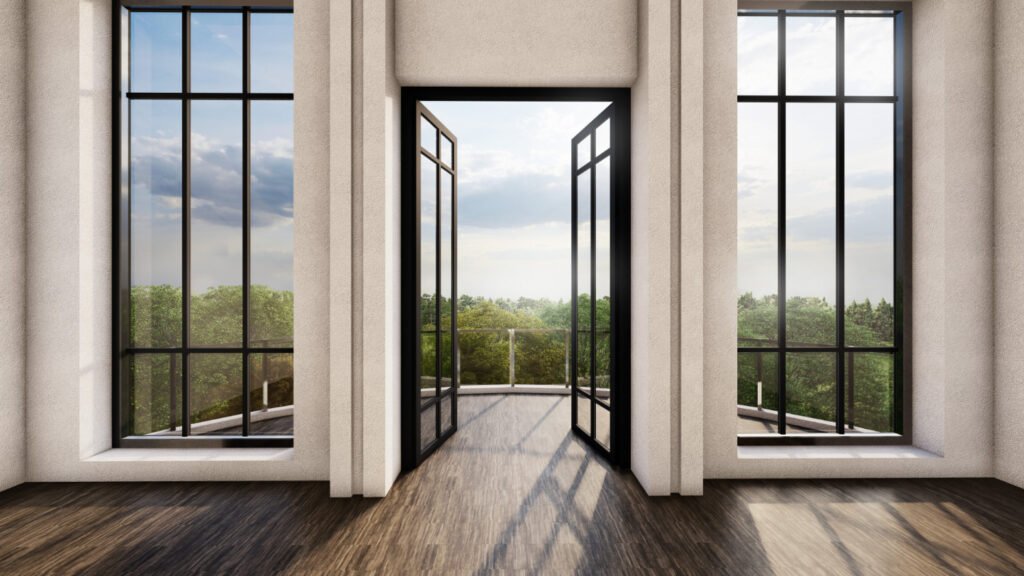 Luxury uPVC doors with slim black frames opening to a balcony, designed for modern homes and natural light.
