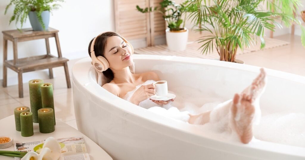 Luxury bathroom design ideas focused on a spa like bathroom with a relaxing soaking bathtub, soft lighting, and modern bathroom design elements that promote wellness and comfort at home