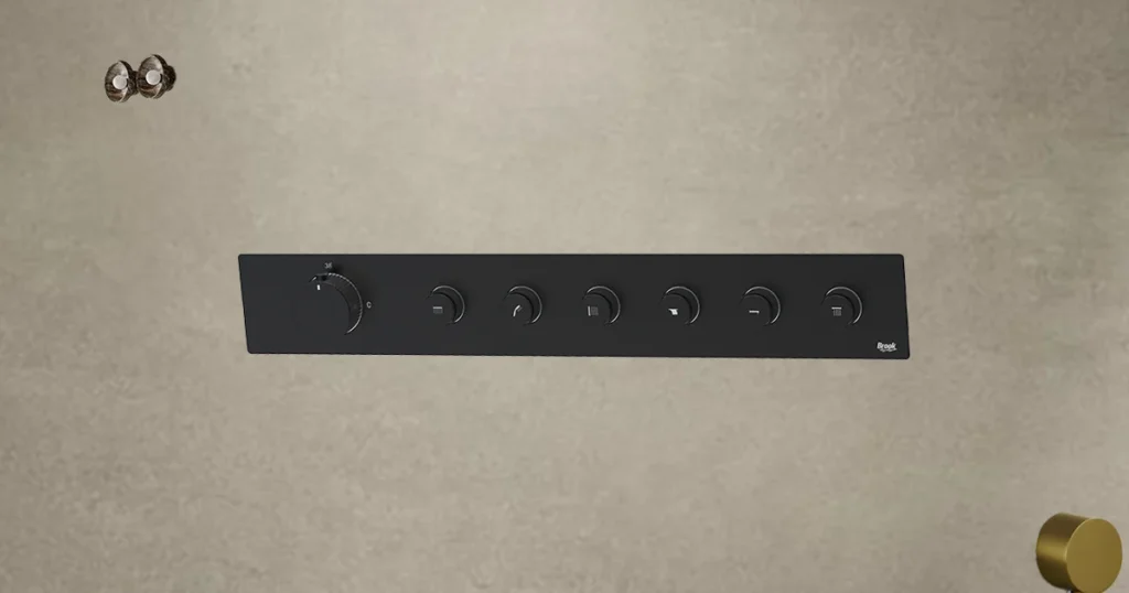 Modern bathroom diverter panel in matte black finish with multiple control knobs for precise water flow